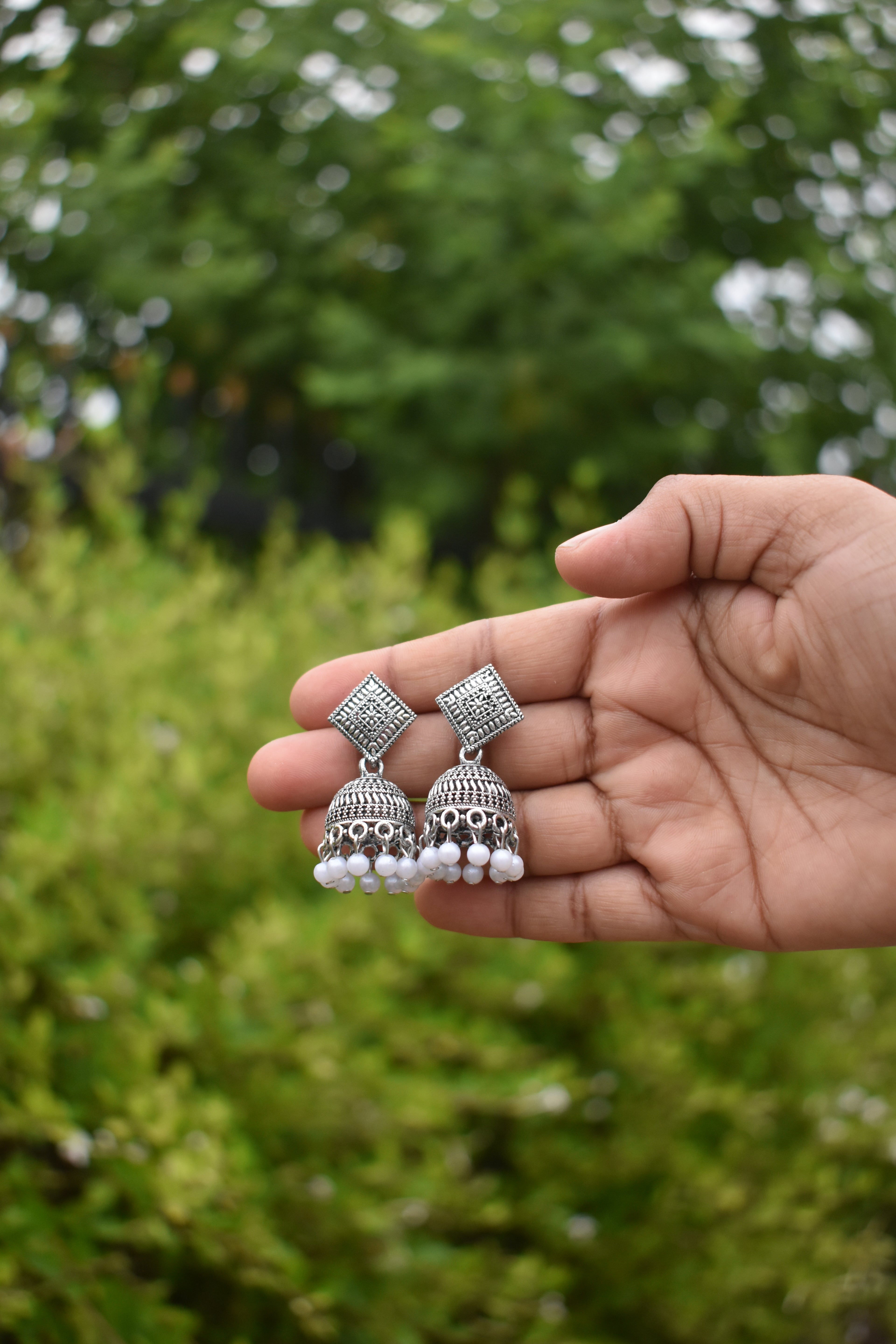 Oxidized Silver Jhumka Earrings with White Beads