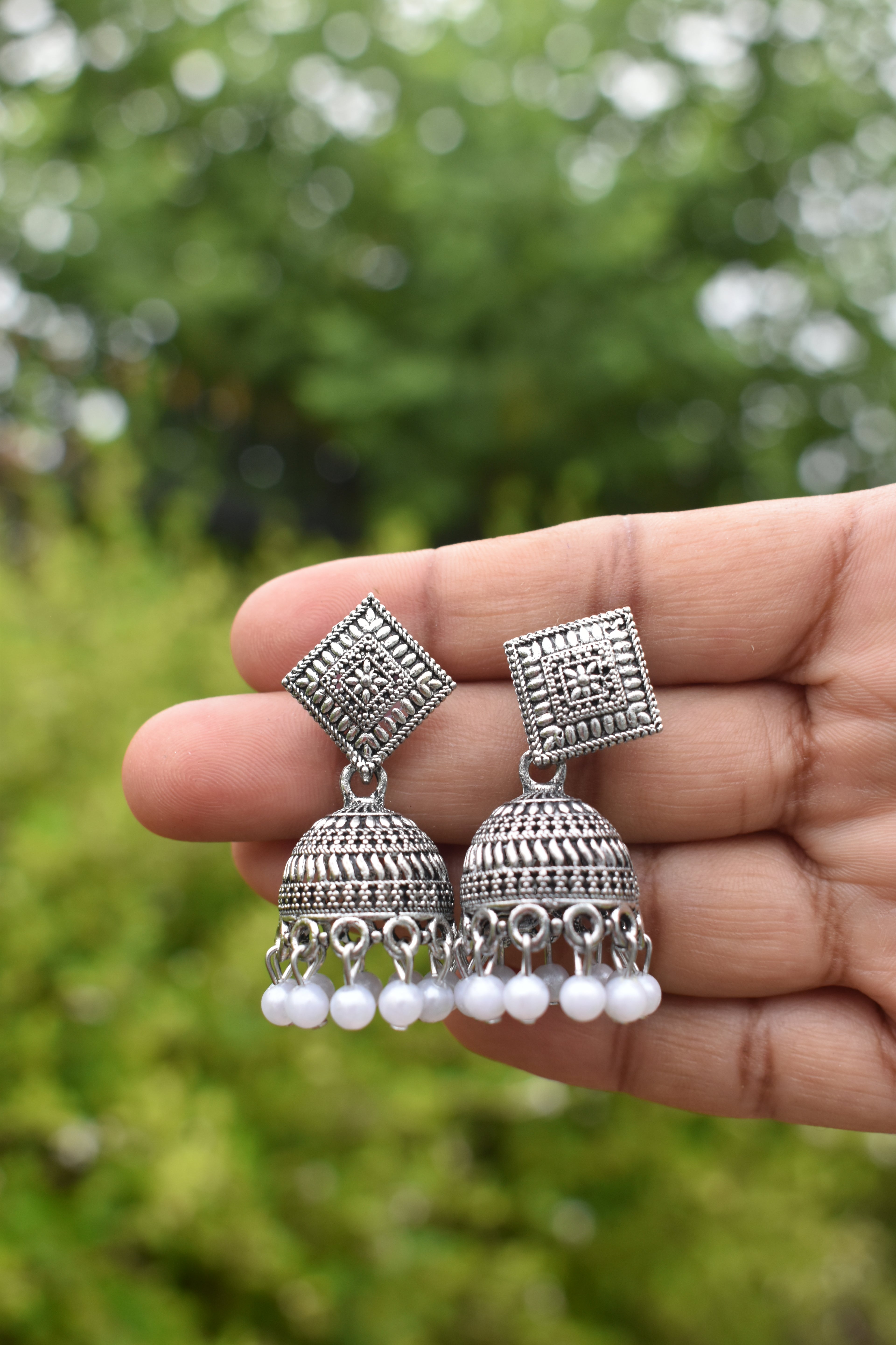 Oxidized Silver Jhumka Earrings with White Beads